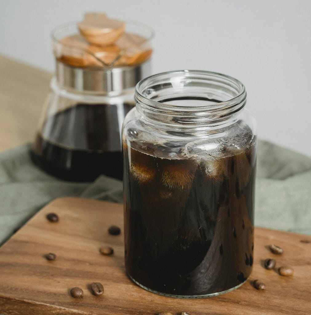 Master the Art: How to Make Coffee Concentrate at Home 18 Black Coffee with Ice in Clear Glass Jar