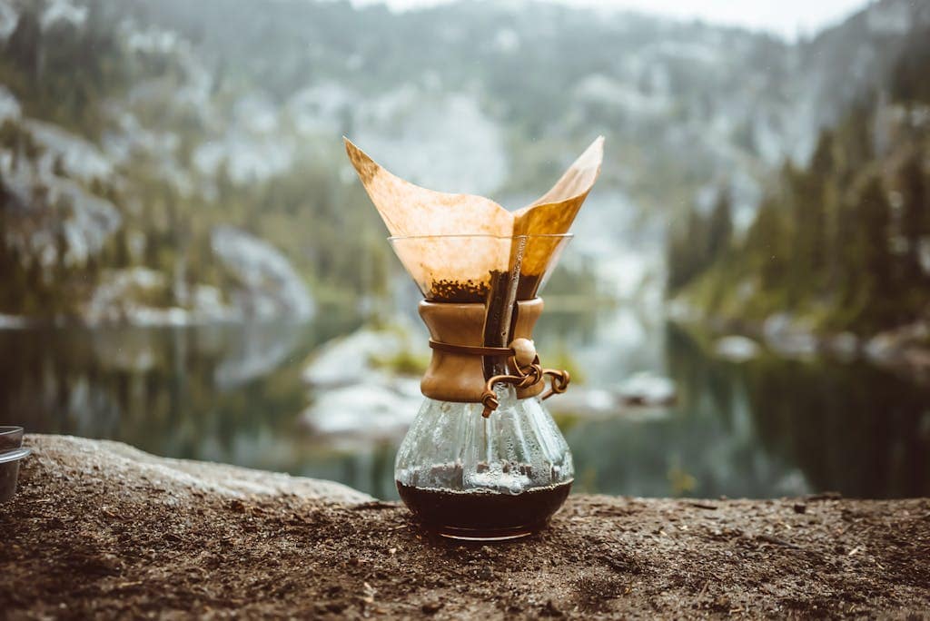 Perfect Your Brew: The Best Temperature to Brew Coffee 4 Chemex pot on rock in mountains
