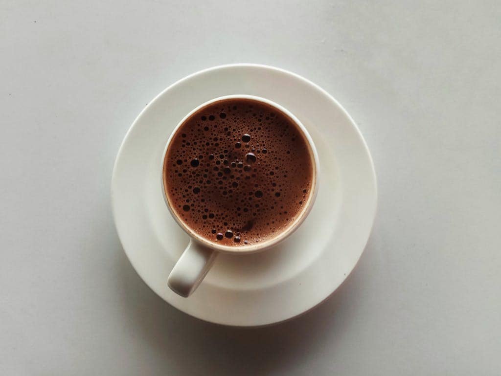 Master the Art: How to Make Coffee Concentrate at Home 19 A cup of hot chocolate on a white plate